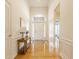 Bright foyer with hardwood floors, an arched doorway, and a glimpse into other rooms at 405 Letterman Dr, Brownsburg, IN 46112