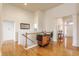 Spacious hallway with hardwood floors, white trim, and access to various areas of the home at 405 Letterman Dr, Brownsburg, IN 46112