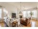 Comfortable living room with a fireplace, hardwood floors, and plenty of natural light at 405 Letterman Dr, Brownsburg, IN 46112