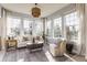 Bright and airy sunroom featuring large windows and comfortable seating at 405 Letterman Dr, Brownsburg, IN 46112