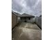 Rear exterior view showing the patio, yard and detached garage at 447 S Bradley Ave, Indianapolis, IN 46201