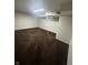 Finished basement area with carpeted flooring and window, providing additional living space at 447 S Bradley Ave, Indianapolis, IN 46201