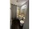 A full bathroom featuring a shower, vanity and toilet at 447 S Bradley Ave, Indianapolis, IN 46201
