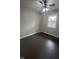 Bedroom features a ceiling fan, hard surface floors, and natural light from the window at 447 S Bradley Ave, Indianapolis, IN 46201