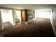 Large living room with fireplace, built-in shelving, and staircase, offering comfort and convenience at 447 S Bradley Ave, Indianapolis, IN 46201