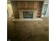 The living room has a cozy fireplace with brick surround and built-in shelving at 447 S Bradley Ave, Indianapolis, IN 46201