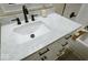 Bright bathroom featuring white marble vanity, a soaking tub, and black hardware at 4504 Winthrop Ave, Indianapolis, IN 46205
