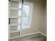 Bedroom featuring modern sliding door and beautiful floors at 4504 Winthrop Ave, Indianapolis, IN 46205