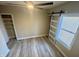 Bedroom with sliding barn door and new flooring at 4504 Winthrop Ave, Indianapolis, IN 46205