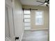 Bedroom with a modern sliding door and neutral paint at 4504 Winthrop Ave, Indianapolis, IN 46205