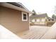 A wooden deck showing the home's tan siding and a view of the backyard at 4504 Winthrop Ave, Indianapolis, IN 46205