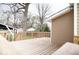 Wooden deck showcasing the home's tan siding and a view of the backyard, perfect for outdoor entertaining at 4504 Winthrop Ave, Indianapolis, IN 46205