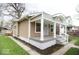 Charming home featuring a covered front porch and classic architectural details at 4504 Winthrop Ave, Indianapolis, IN 46205