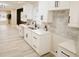 Well-lit kitchen featuring white cabinetry, stainless steel appliances, and a stylish backsplash at 4504 Winthrop Ave, Indianapolis, IN 46205