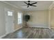 Bright, newly renovated living room with modern ceiling fan and new flooring at 4504 Winthrop Ave, Indianapolis, IN 46205