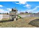Expansive backyard featuring a charming playhouse and a classic white picket fence at 491 Tracewood Bnd, Greenfield, IN 46140