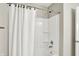 Clean bathroom featuring a shower with white tile and convenient built-in shelving at 491 Tracewood Bnd, Greenfield, IN 46140