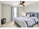 Relaxing bedroom with a ceiling fan, and a window with natural light at 491 Tracewood Bnd, Greenfield, IN 46140