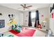 Colorful ' bedroom featuring cartoon wall art, a window, and carpet at 491 Tracewood Bnd, Greenfield, IN 46140