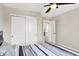 Inviting bedroom with a ceiling fan and a double door closet at 491 Tracewood Bnd, Greenfield, IN 46140