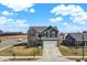 Charming two-story home boasting a well-manicured front yard and attached two car garage at 491 Tracewood Bnd, Greenfield, IN 46140