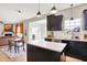 Modern kitchen featuring granite countertops, stainless steel appliances, a center island, and an open-concept design at 491 Tracewood Bnd, Greenfield, IN 46140