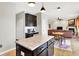 Kitchen features dark cabinets, granite countertops, stainless appliances, and an island workspace at 491 Tracewood Bnd, Greenfield, IN 46140