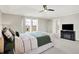 This main bedroom features a large bed, carpeted floors, multiple windows, and a ceiling fan at 491 Tracewood Bnd, Greenfield, IN 46140