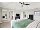 This main bedroom features a large bed, carpeted floors, multiple windows, and a ceiling fan at 491 Tracewood Bnd, Greenfield, IN 46140