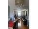 Open dining room with hardwood floors and natural light adjacent to the living room at 4930 Candy Spots Dr, Indianapolis, IN 46237