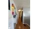 Hallway with hardwood floors providing access to the kitchen and other rooms at 4930 Candy Spots Dr, Indianapolis, IN 46237