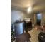 Functional laundry room equipped with modern washer and dryer units, and ample floor space at 4930 Candy Spots Dr, Indianapolis, IN 46237
