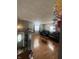 Open concept living room with hardwood floors and plenty of natural light from windows at 4930 Candy Spots Dr, Indianapolis, IN 46237