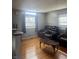 Bright living room features hardwood floors, and large windows for an abundance of natural light at 4930 Candy Spots Dr, Indianapolis, IN 46237