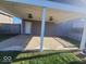 Covered patio featuring a stamped concrete floor, overhead lighting, and convenient backyard access at 4930 Candy Spots Dr, Indianapolis, IN 46237