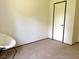 Standard bedroom with carpet, neutral walls, and a door at 5010 S 550 W, Columbus, IN 47201