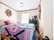 Cozy bedroom featuring a decorative wall art, comfortable bed, and a TV, creating a relaxed and inviting space at 5010 S 550 W, Columbus, IN 47201