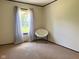 Standard bedroom with a chair, carpet, and neutral walls at 5010 S 550 W, Columbus, IN 47201