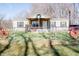 Charming single-story home with a welcoming front porch and decorative wreath at 5010 S 550 W, Columbus, IN 47201