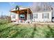 Charming single-story home with a welcoming covered front porch with seating area at 5010 S 550 W, Columbus, IN 47201