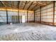 Spacious, unfinished barn interior with metal walls and exposed beams, providing ample storage at 5010 S 550 W, Columbus, IN 47201
