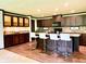 This stylish kitchen features an island, dark cabinetry, granite countertops, and stainless steel appliances at 5010 S 550 W, Columbus, IN 47201