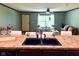 Bright living room with lots of natural light and view from eat in kitchen at 5010 S 550 W, Columbus, IN 47201
