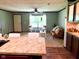 Cozy living room featuring a ceiling fan, lots of light and contemporary furniture at 5010 S 550 W, Columbus, IN 47201