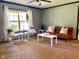 Sun-filled living room with neutral carpet, modern furnishings, and soft, natural light from a nearby window at 5010 S 550 W, Columbus, IN 47201