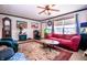 Inviting living room with a ceiling fan, a decorative rug, and an aquarium at 5010 S 550 W, Columbus, IN 47201