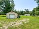 Shed with garage door on a grassy field at 5010 S 550 W, Columbus, IN 47201