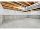 Spacious unfinished basement with white plastic covering walls providing a blank canvas for future renovation at 5520 N Woodside Ct, McCordsville, IN 46055