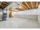 Large, unfinished basement area with concrete walls, exposed ductwork, and staircase, ready for customization at 5520 N Woodside Ct, McCordsville, IN 46055