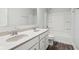 Bright bathroom featuring a double sink vanity with a granite countertop and a shower over tub combination at 5520 N Woodside Ct, McCordsville, IN 46055
